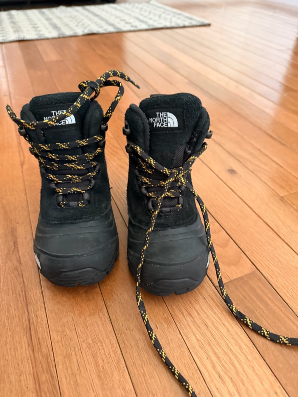 The North Face Black Boots with Yellow-Patterned Laces